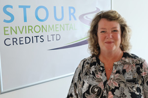 Tracey Butler standing infront of the Stour Environmental Credits logo